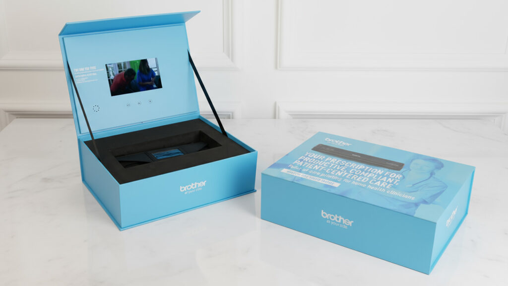Brother video box showcasing portable printer with interactive video display.