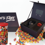FOX IT custom video box with built-in HD screen, branded Jelly Belly jar, and dispenser used for tech sales prospecting.