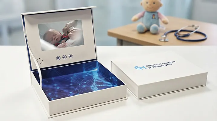 Healthcare professional using a video brochure to explain medical information in a clinic