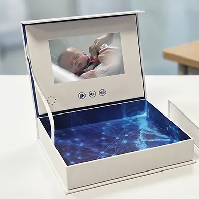 Person engaging with a video brochure in a cozy living room